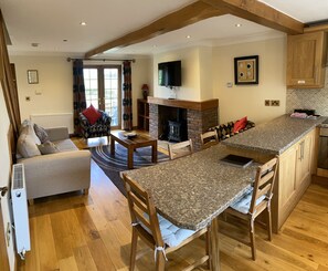 Fully equipped kitchen with open plan living room.