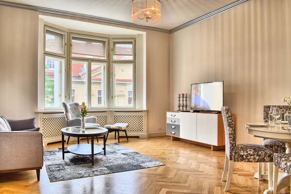 Spacious living room with modern Smart TV and a dining area