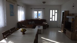 living room with dining area and kitchen