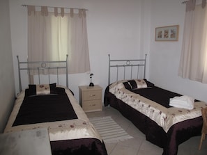 one of the twin Bedrooms