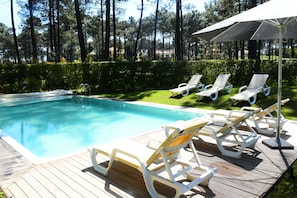 Pool with sunbathing area