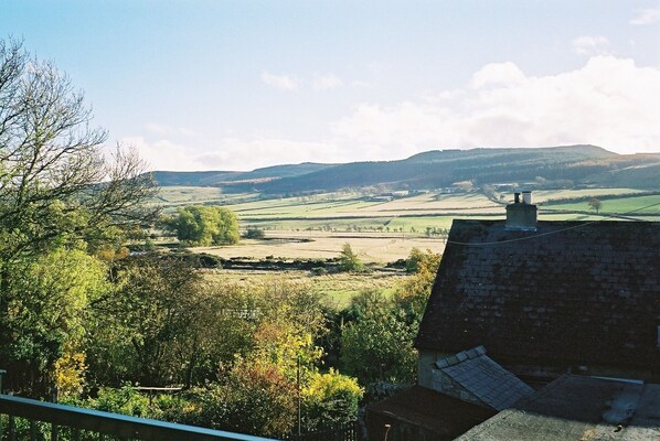 View from balcony outside lounge over River Coquet towards Simonside Hills