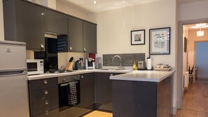 Fully equipped kitchen with modern appliances.