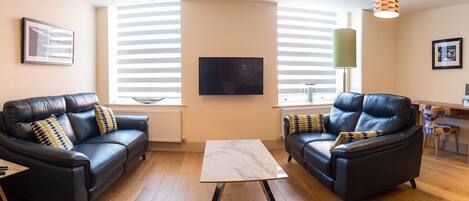 Elegant furnishings in living room. Smart TV.
