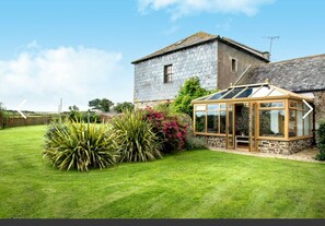 THE GRANARY WITH CONSERVATORY LEADING TO THE LARGE ENCLOSED GARDEN