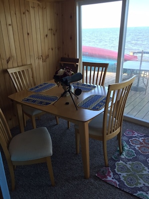 Dinner table opposite a nice comfortable recliner!