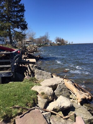 Lake on a windy day. The shoreline is built up with rocks access more difficult.