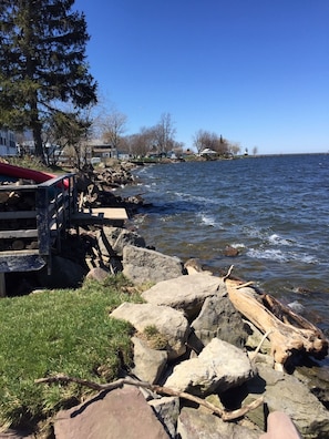 Lake on a windy day. The shoreline is built up with rocks access more difficult.