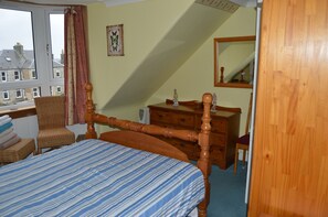 Double bedroom with pine furnishings. 