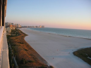 Take in 5 miles of sugar white sand beach looking south from your balcony