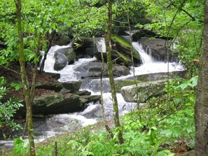 Upper waterfall and Laughing Waters Creekside Cottage
