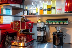 The petite yet complete kitchen is a gourmand's dream with an espresso maker, an induction cooktop