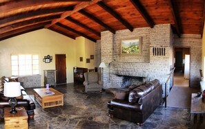 Living room with stone fireplace