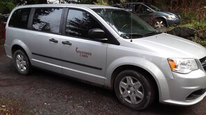 6 passenger van staged at airport for your arrival