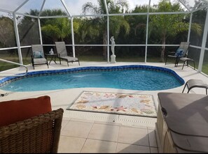 Brand new heated pool  surrounded by queen and pigmy palms + privacy fence.