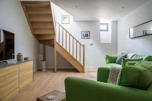 TV room with sofa bed on lower floor 