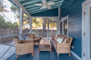 Screened in porch with comfortable seating