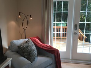 French doors open to private living room space with mini-kitchen.
