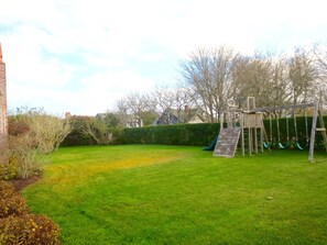 Swing set with room for plenty of games: croquet, badminton, soccer, etc.