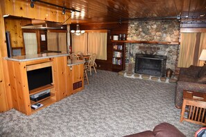 Living room with fireplace. Firewood provided in season.