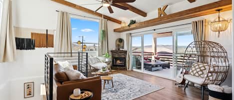 Upper Livingroom, fireplace, double sliding doors and a view of Sedona red rocks