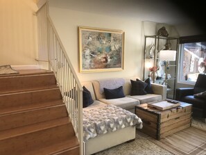 LIVING ROOM/STAIRS TO THE TWO BEDROOMS ON THE SECOND FLOOR.
