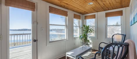 Sun-drenched lakeside sunroom