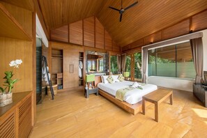 Bedroom with 1 king bed, satellite TV, DVD player, balcony, & en-suite bathroom