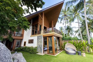 This villa is surrounded by a beautiful garden.