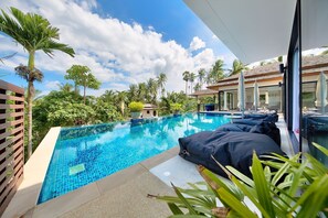 12m infinity pool with shallow area for children and 4 bean bags with umbrellas