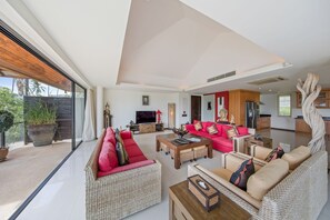 The indoor living area has smart TV, satellite TV, DVD player and sound system.