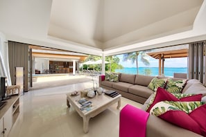 Indoor living area with smart TV, satellite TV, and speakers