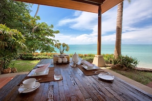 Outdoor beach sala and dining area with access to beach