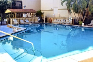 Enjoy the large heated pool or relax the afternoon away on a lounger.