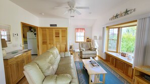 Living room has comfortable seating and flat screen TV