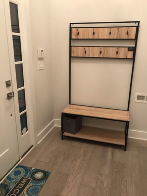 Entryway towel and flip flop holder 