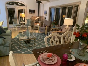 The fireplace encompasses the entire living room and dining area.