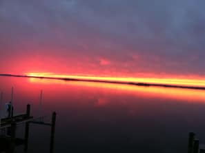 Sunset view from the decks, sunroom, living room, dining room and kitchen.