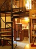 Spiral staircase leads up to bedroom in the loft & selection of books to enjoy.
