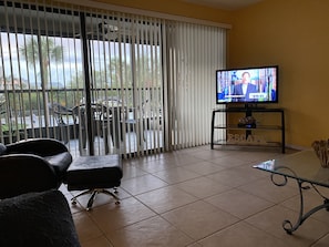 Photo taken of living room with blinds closed. 