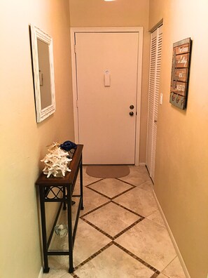 Welcoming entry hall with utility closet