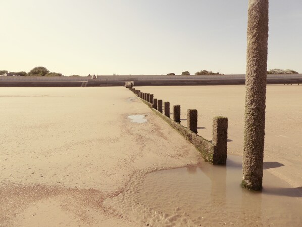 Sandy beach only mins walk from the bungalow with puddles at low tide to play in