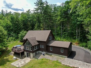The back of the house showing the sunroom and part of the deck