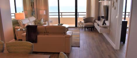 Living room and dining room looking at the ocean