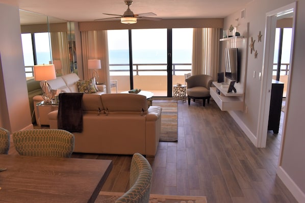 Living room and dining room looking at the ocean