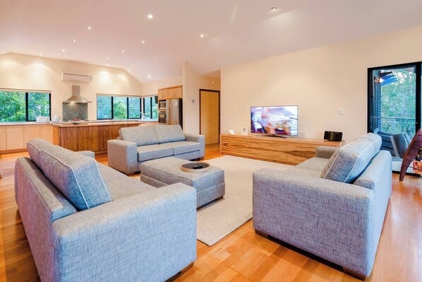 Sink into soft lounges and unwind with your favourite show on the big-screen TV, surrounded by expansive windows that frame the calming sights and sounds of the bush.