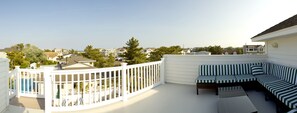 Roof deck with sectional and ocean views