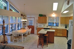 View of kitchen and dining area from living room
