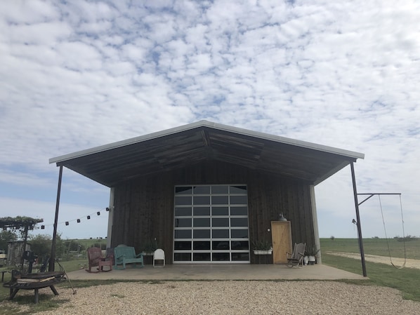 Newly renovated  - wood exterior, vintage tin ceiling & roll up door