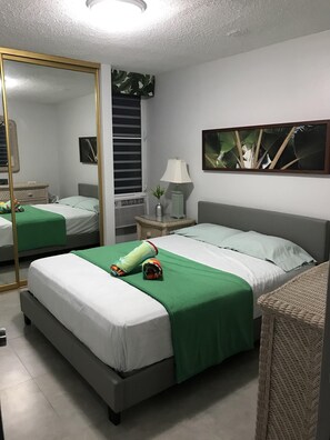Master bedroom with a queen size bed